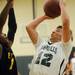 Greenhills junior Andrew Khouri looks to shoot around Eastern Washtenaw Multicultural sophomore Kornelius Saxton during the second half at Greenhills on Thursday. Melanie Maxwell I AnnArbor.com